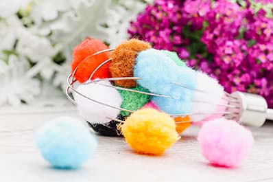 Pom pom whisk activity